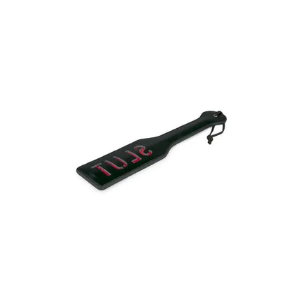 Black Leather Paddle - Slut with red inscription, smooth leather, ergonomic design.