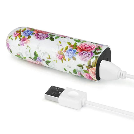 Vibrating Bullet Aphrodite with USB charging cable, floral design, compact and travel-friendly.