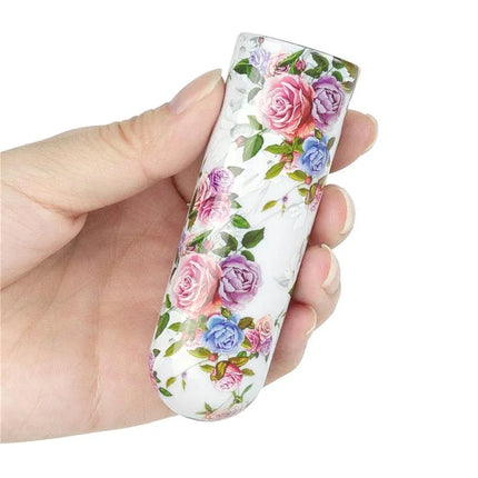 Floral design Vibrating Bullet Aphrodite held in hand, showcasing compact travel-friendly size and USB-rechargeable feature.