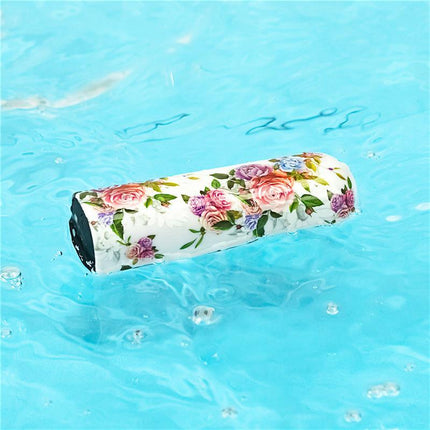 Vibrating Bullet Aphrodite floating on water with floral pattern, highlighting its discreet and travel-friendly design.