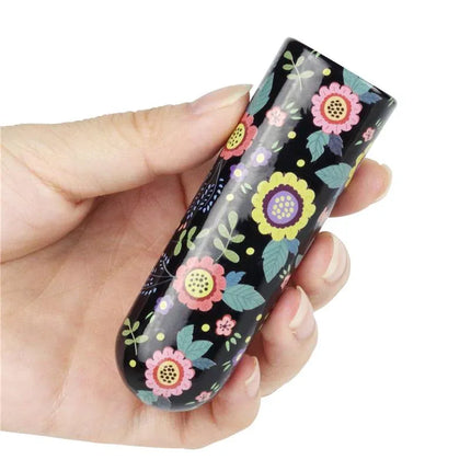 Vibrating Bullet Diana held in hand, featuring colorful floral design for discreet pleasure and travel-friendly use.