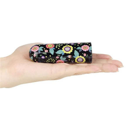 Compact Vibrating Bullet Diana resting on a hand showcasing its floral design, ideal for discreet and travel-friendly pleasure.