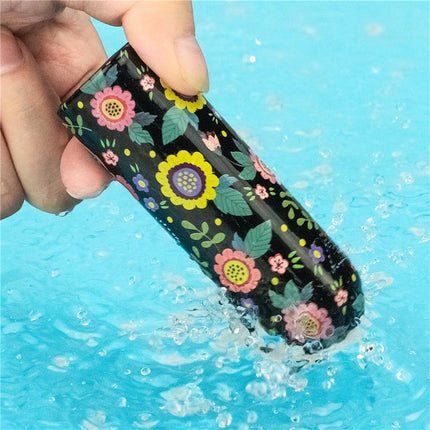 Hand holding Vibrating Bullet Diana with floral design in water