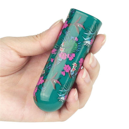 Vibrating Bullet Antheia held in hand, showcasing compact, floral design ideal for discreet, travel-friendly pleasure use.
