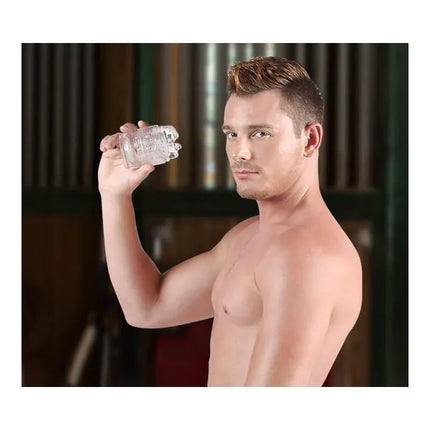 Model holding Masturbator Brent Corrigan Bliss Anus, showcasing lifelike texture and compact design for intense pleasure.