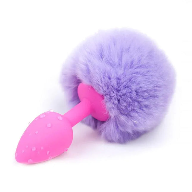 Butt Plug with Pompon Light Purple Size S featuring a sleek design and playful pompon.