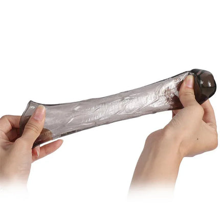 Hands holding a flexible sleeve from the Pack 3 Pennis Sleeve Alex Black, showcasing its stretchable and phthalate-free TPE material.