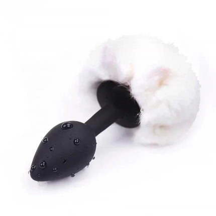 Butt Plug with Pompon White Size S, featuring a black base with a fluffy white pompon design, ideal for beginners seeking stylish pleasure.