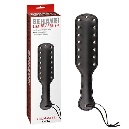 Spanking Paddles Black Yes, Master next to packaging, featuring soft PU material and textured tacks for varied sensation play.