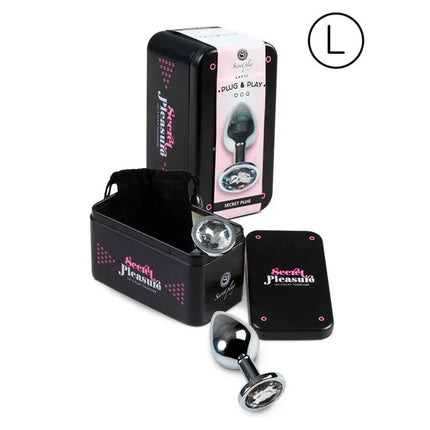 Butt Plug Size L Clear with decorative base, shown with packaging and storage case.