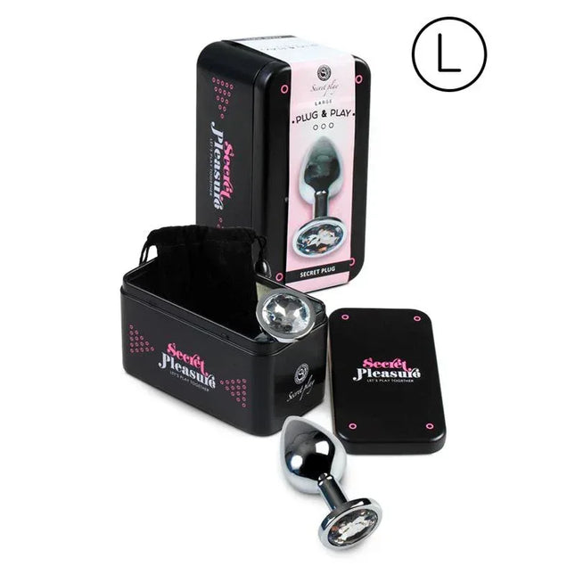 Butt Plug Size L Clear with decorative base, shown with packaging and storage case.