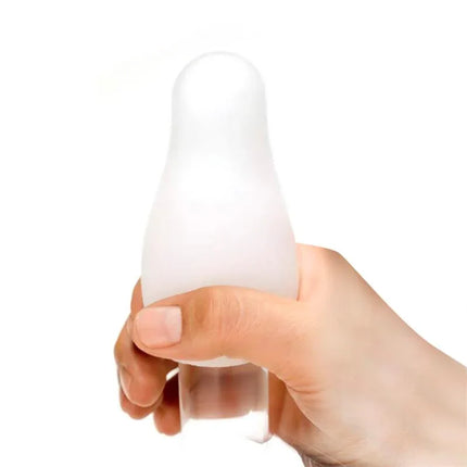 Person holding Bumpy Masturbator Egg Elastic Green by Nanami for discreet pleasure.