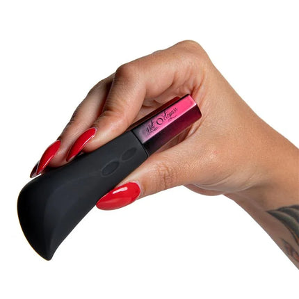 Hand holding Stimulator Amo Black with premium silicone design and powerful motor for deep pleasure.