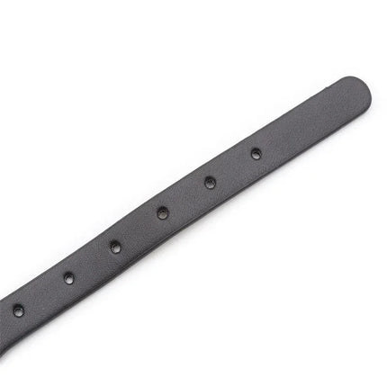 Close-up of the Collar with Hoop and Bell Black, featuring black leather band with hoop holes, part of the BDSM collection.