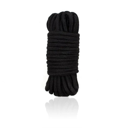 Bondage Cotton Rope 10 Meter Black coiled for versatile BDSM use, blending softness and control for immersive experiences.