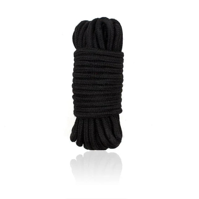 Bondage Cotton Rope 10 Meter Black coiled for versatile BDSM use, blending softness and control for immersive experiences.