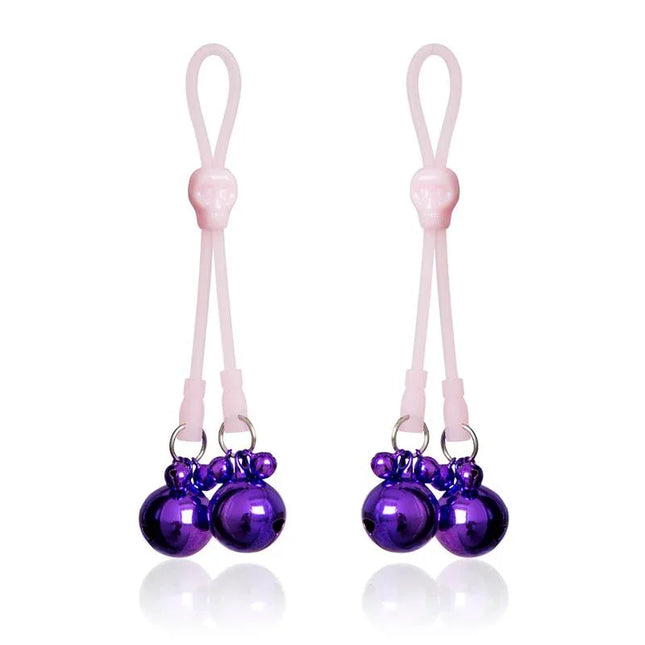Nipple Clamps Skulls and Ring Bells Silicone and Metal Pink/Purple, featuring skull design and purple bells for intense experience.