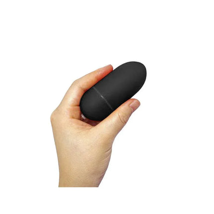 Vibrating Egg 10 Functions Black held in a hand showcasing its compact, discreet design.
