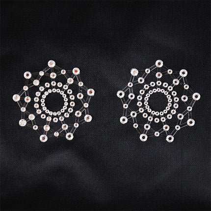 Snowflake Nipple Covers White - self-adhesive snowflake-shaped nipple cups for BDSM and cosplay. Enhance your look with daring style.