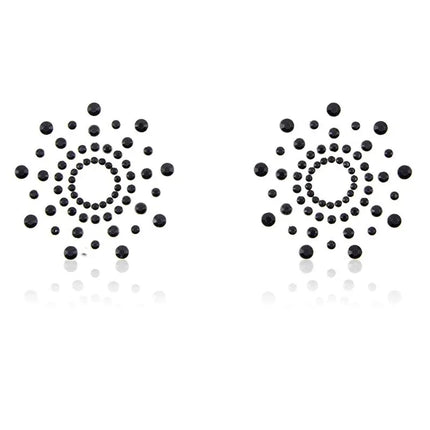Snowflake Nippel Covers Black with sleek self-adhesive backing and unique snowflake shape designed for bold visual appeal in BDSM attire.