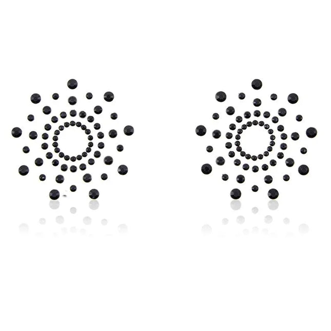 Snowflake Nippel Covers Black with sleek self-adhesive backing and unique snowflake shape designed for bold visual appeal in BDSM attire.