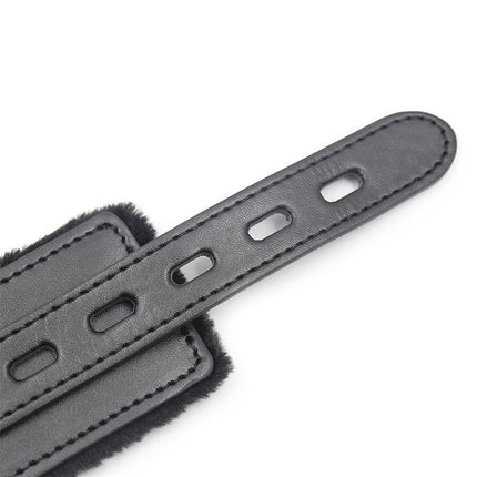 Close-up of Collar With Metal Leash Black showcasing adjustable strap and sleek design for versatile styling in bondage play.