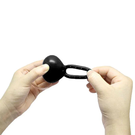 Vibrating Cockring with Remote Control Black held in hands showcasing design and versatility.