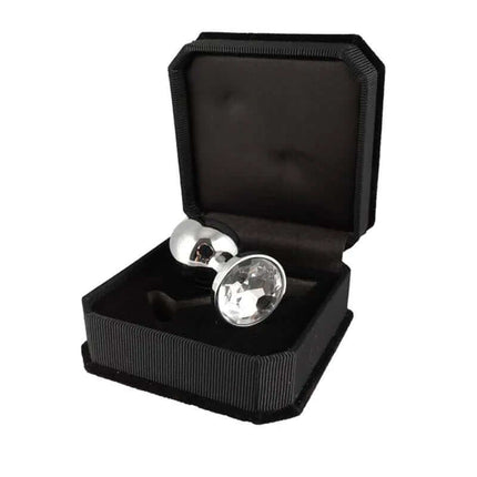 Butt plug, metal-7,3 cm long with surgical steel and clear glass top in black box, offering premium stimulation.