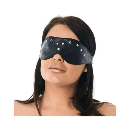 Blindfold-Adjustable leather mask with rivet accents on person, featuring adjustable metal buckle strap, designed for sensory enhancement.
