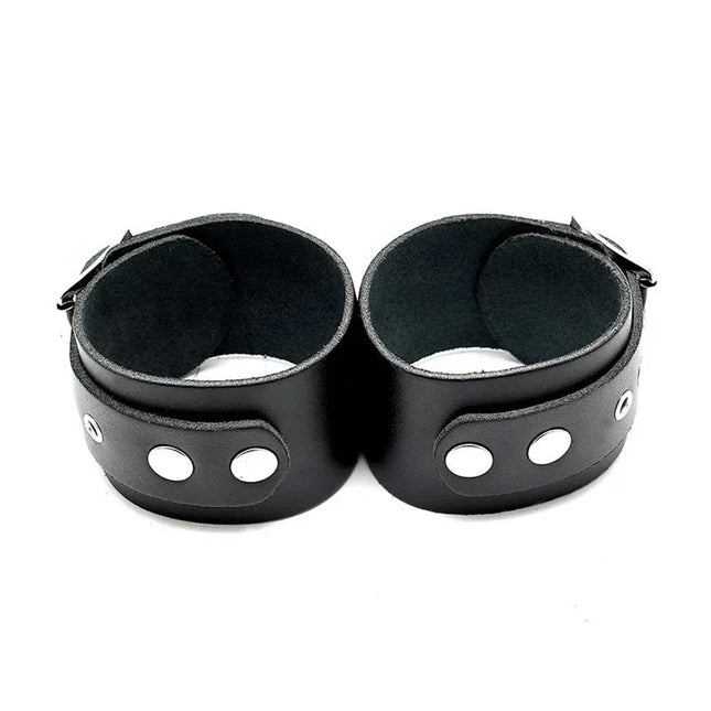 Leather Cuffs Adjustable - genuine leather black cuffs with buckles for comfort and intimate restraint.