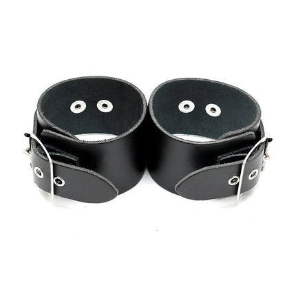 Leather Cuffs Adjustable in genuine black leather with buckles for versatile restraint, designed for comfort and intimate moments.