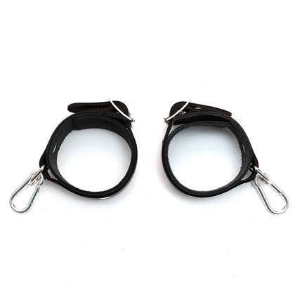 Leather Cuffs Adjustable black leather restraints with metal buckles, crafted for comfort and durability.