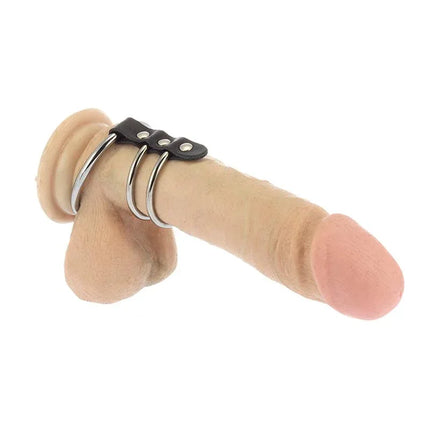 Penis Tube Adjustable cock ring on realistic dildo model showing leather and metal construction for enhanced performance.