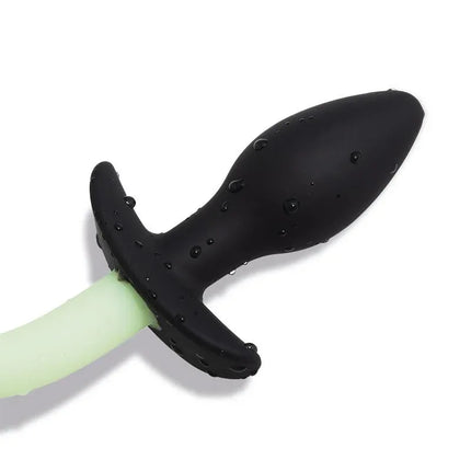 Glow in the Dark Dog Tail Butt Plug showcasing black silicone plug and luminous green tail for role-play.