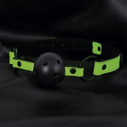 Glow in the Dark Bondage Set with 5 Pzs featuring breathable ball gag on black background