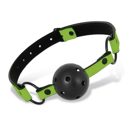 Glow in the Dark Breathable Ball Gag with green straps for illuminated intimacy and comfortable performance in fetish play.
