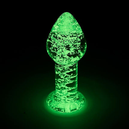 Glow in the Dark Glass Butt Plug illuminated in low light, enhancing intimate moments with premium durable material for fetish enthusiasts.