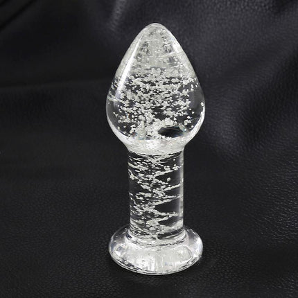 Glow in the Dark Glass Butt Plug on black background, illuminating low light intimate moments with premium design and durability.