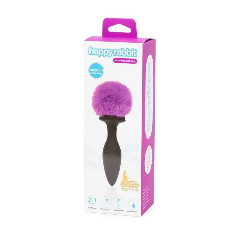 Purple anal plug with large fluffy pom-pom and double base in black silicone packaging.