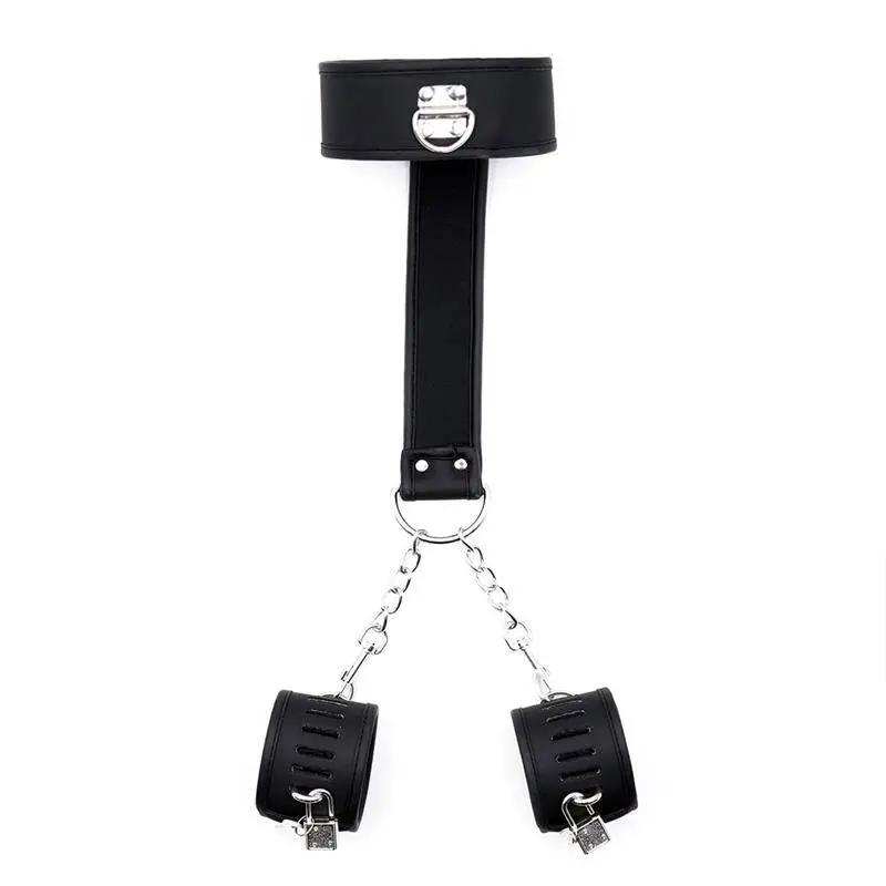 Black vegan leather collar with attached wrist handcuffs and silver metal hardware.