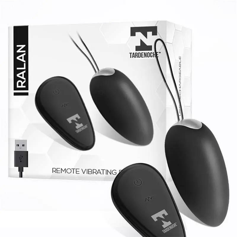 Black vibrating egg with remote control and magnetic USB charger alongside white and black product packaging with brand logo.