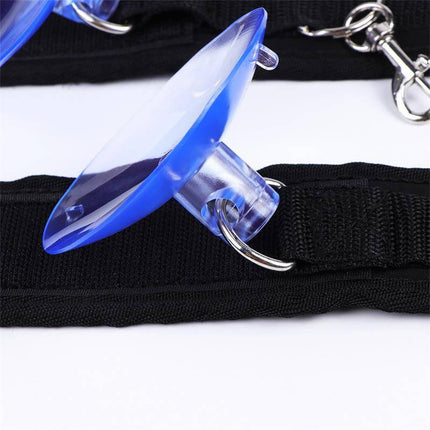 Close-up of Adjustable Anklecuffs with Suction Cups from Latetobed's BDSM line, featuring a blue suction cup and black strap with metal rings.