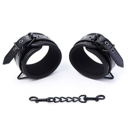 Adjustable Handcuffs Sapphire Vegan Leather with black chain connector displayed on white background.