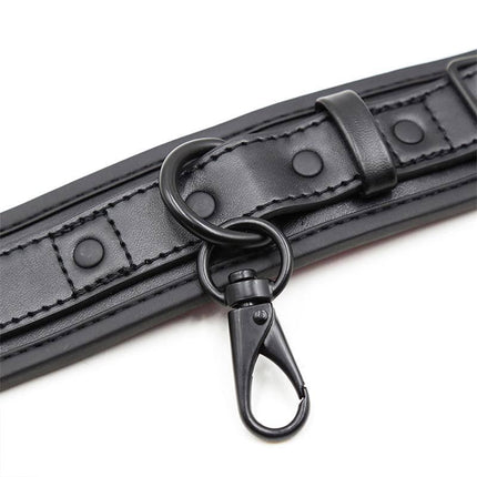 Black Adjustable Neoprene Handcuffs with removable chain clasp for secure and comfortable restraint.