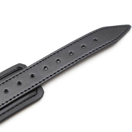 Close-up of a strap from Adjustable Neoprene Handcuffs with multiple holes for adjustable fit.