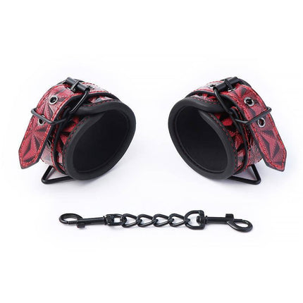 Adjustable Padded Handcuffs Diamond Vegan Leather, red vegan leather restraints with black chain for BDSM enthusiasts.