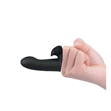 Adonis Finger Sleeve Vibrator Black worn on a finger, showcasing the smooth silicone texture and compact design for targeted stimulation.