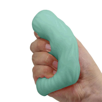 Hand holding Alice Men Masturbator Turquoise with wavy surface texture.