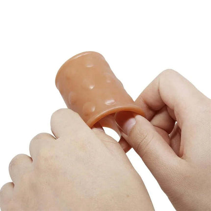 Hands holding an Anal Plug with Penis Sleeve for enhanced stimulation and support.