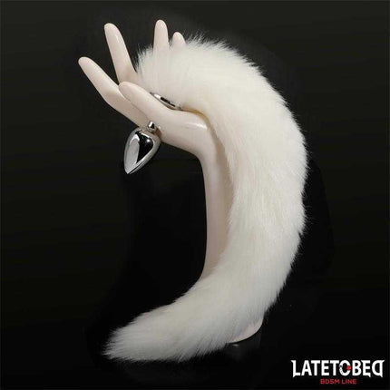 Anal Plug with Tail 40 cm - White with silky tail displayed on mannequin hand from Latetobed BDSM Line.